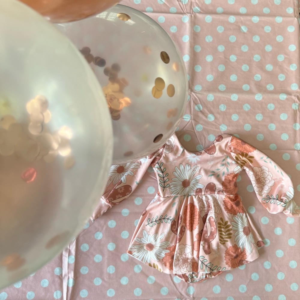 Floral pink long sleeve bodysuit with attached skirt